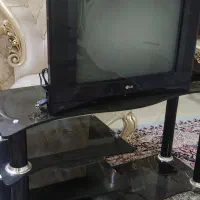 تلویزیون ۲۱ اینچ ال جی به همراه میز شیشه ای