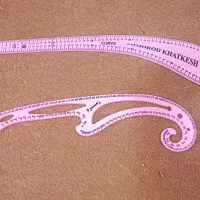 خط کش و کتاب خیاطی