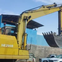 بیل مکانیکی لاستیکی اچ100