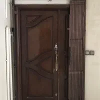 درب ورودی چوب راش و حفاظ آهنی تسمه سنگین