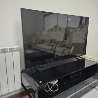 تلویزیون شیشه شکسته سامسونگ و میز تلویزیون