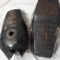 ۱عدد باک و ۱عدد زین و زنجیر و خورشیدی موتورسیکلت