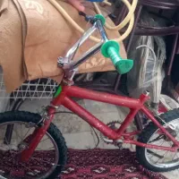 دوچرخه 16 سه تومن وقرمز