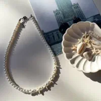 گردنبند مرواریدی و ستاره دریایی و وال