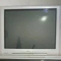 یک عدد تلویزیون و میز تلویزیون