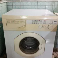 ماشین لباسشویی خشک کن هایر ایتالیایی سالم