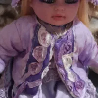 عروسک موزیکال بنفش دخترانه