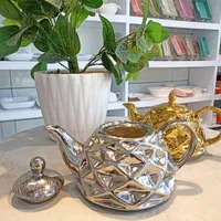 قوری طلایی زیبا|قوری، کتری، قهوه‌ساز دستی|قم, نیروگاه|دیوار