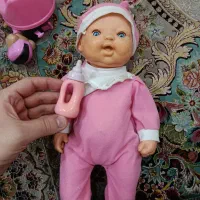 عروسک سیلیکونی نی نی گریه کن به همراه شیشه شیر