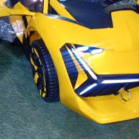 ماشین شارژی زرد درب جکدار چهار موتوره