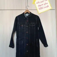 تعدادی مانتو جمع‌شدهٔ مغازه|لباس|سهند, |دیوار
