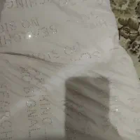 کاپشن صورتی کم رنگ نگین دار