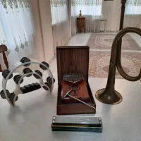 کالیمبا ، هارمونیکا، تامبورین و شیپور
