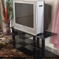 تلویزیون پاناسونیک تمیز وبزرگ  ومیز شیشه ای