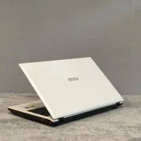 لپتاپ سفید رنگ msi با هارد یک ترا / نیترو سیستم