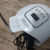 یک عدد دستگاه و یک عدد قلم مو در حد نو