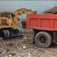 تخریب  ساختمان همراه با بیل لودر و پی کنی و تصحیح
