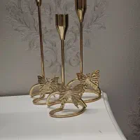 جا شمعی همراه گل و گلدان