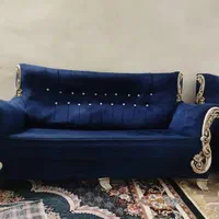 مبل سرمه ایی و میز جلو مبلی سفید رنگ