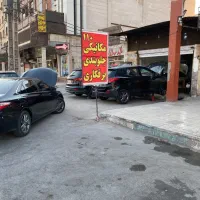 استاد کار مکانیک و شاگرد مکانیک