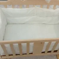 تخت نوزادی کنار مادر