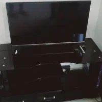 میزتلویزیون شیشه ای.دارای کشو