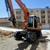 بیل میکانیکی اطلس چرخ لاستیکی