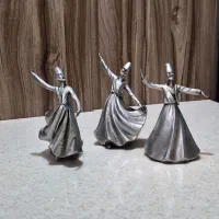 مجسمه‌های رقص سماع نقره‌ای