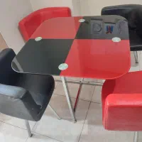 میز چهار نفره شیشه ای و صندلی چرمی