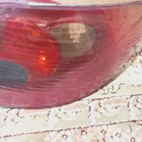 206 چراغ جلو یک عدد  و  یک جفت چراغ عقب 206