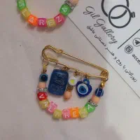 سنجاق سینه نوزادی و دستبند