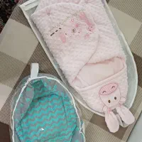 آغوشی سوئیسی نوزاد و کیسه خواب در حد نو