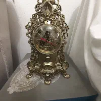 ساعت طرح برنز رنگ‌ ثابت