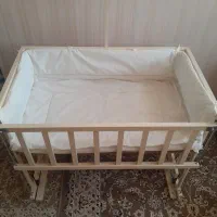 گهواره کنار تخت مادر