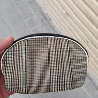 کیف زنانه کوچک پیدا کرده ام