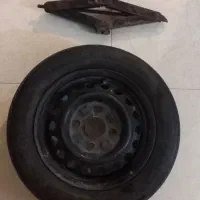 چرخ پراید همراه با جک و آچار