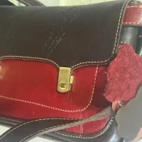 کیف چرم مشکی زرشکی