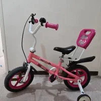 دوچرخه صورتی بچه با کمکی