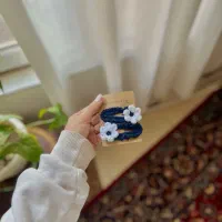 عروسک بافتنی،دسته گل