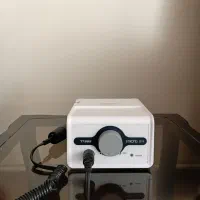 دستگاه کاشت ناخن