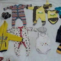تعدادی لباس نوزادی ۱۱ تکه