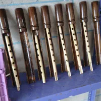 سازنده و نوازنده نی انبان.|سازهای بادی|شهرکرد, |دیوار