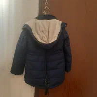 ۲تا کاپشن|لباس|قم, بنیاد|دیوار