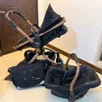 کالسکه و کریر و تخت گهواره کنار مادر