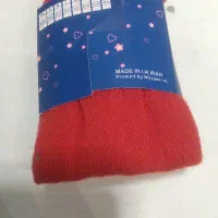 چند عدد جوراب شلواری بچه گونه با رنگ قرمز