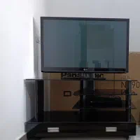 زیر تلویزیونی شیشه ای