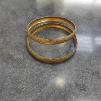 طلا ۲ عدد النگو(وزن ۱۲/۷۶۰) قیمت ۱۴۰ بالای تابلو