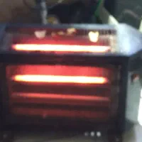 بخاری برقی تکنو و دستگاه اتوی لوله آب