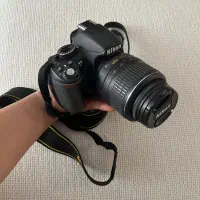 دوربین nikon d3100 با لنز ۵۵-۱۸