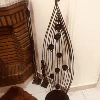 جاشمعی آهنی و مجسمه چوبی